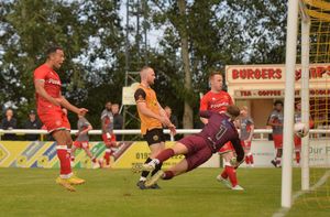 Johnson scores for the Saddlers as Douglas James-Taylor watches on
