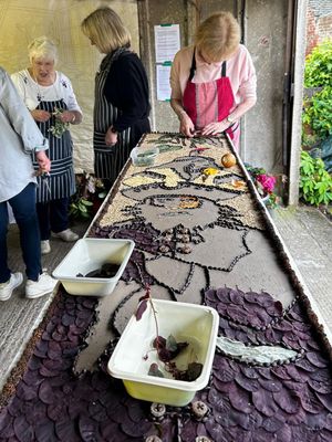 A well dressing under construction.