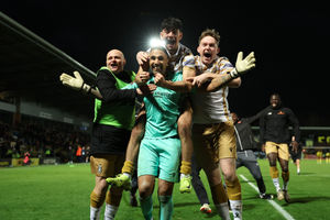 Tamworth celebrate in the wake of their stunning FA Cup penalty success over Burton to reach the third round. Pic: Getty