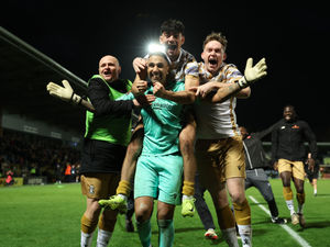 Tamworth celebrate in the wake of their stunning FA Cup penalty success over Burton to reach the third round. Pic: Getty