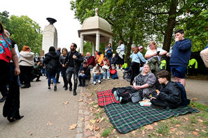 Some brought their picnic blankets to sit on in Green Park.