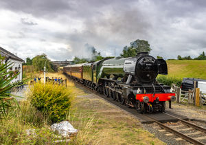 The 'Flying Scotsman' passes Crossing Keeper's Cottage during the Swinging Sixties event. Photo: Keith Whitehurst