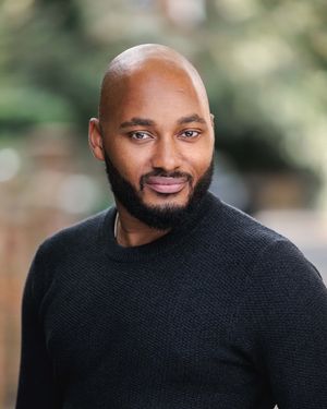 Local performer Dom Harley Harris appears as John.