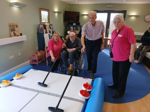Residents at Uplands Care Home in Shrewsbury have been having a go at indoor curling