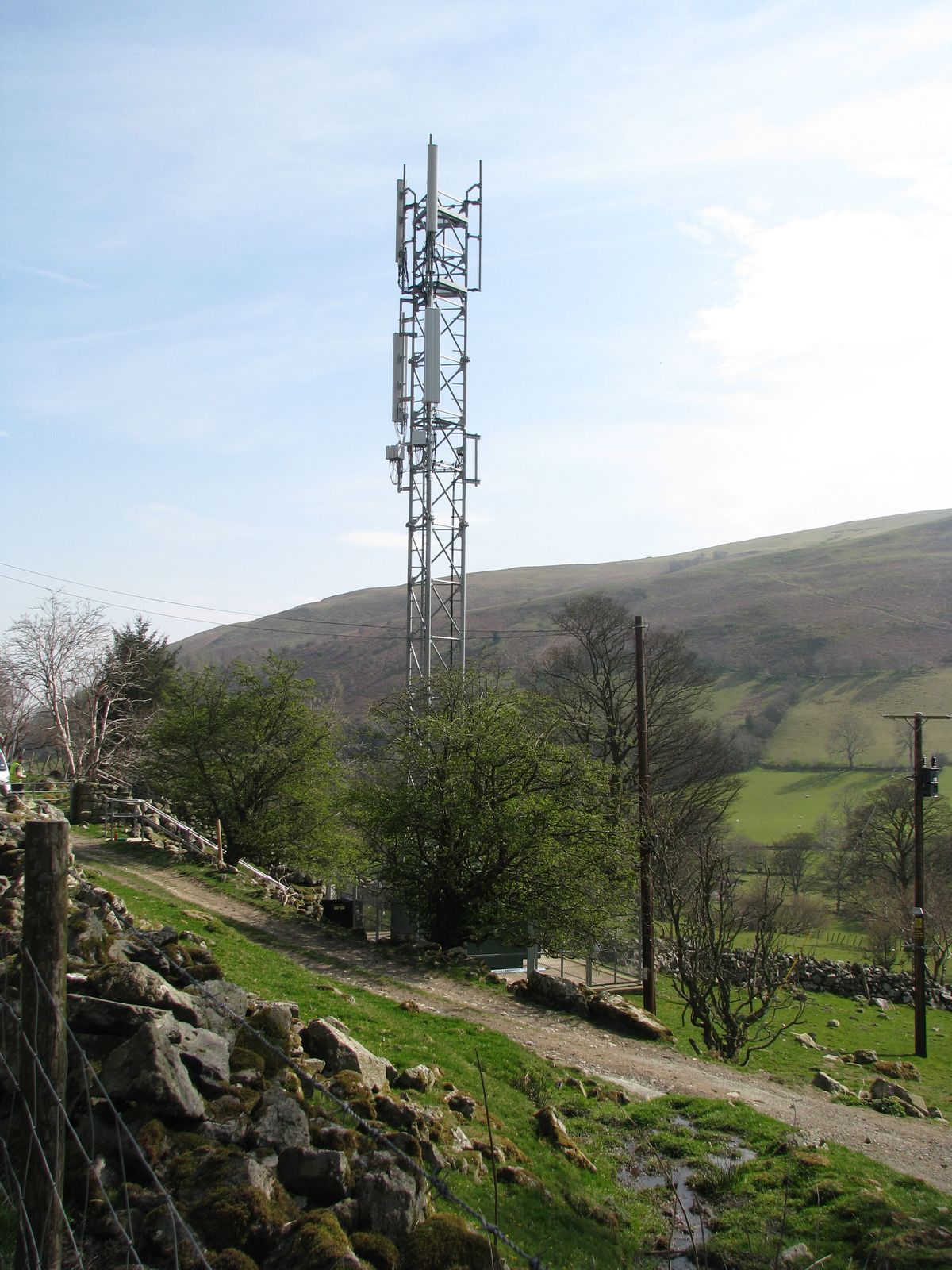 Mobile phone coverage boosted in several Powys communities after a mast upgrade