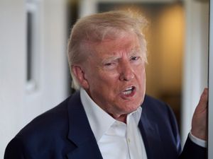 Donald Trump speaking to reporters on Air Force One