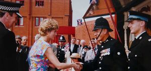 Former Superintendent Joe Davies dons his old uniform as he greets Princess Diana at the opening of Bilston Street Police Station in 1992.
