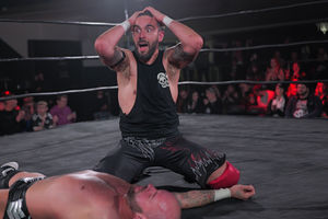 Eddie Dennis celebrates becoming a tag team champion. Photo: Tony Knox and Burning Heart Pro Wrestling