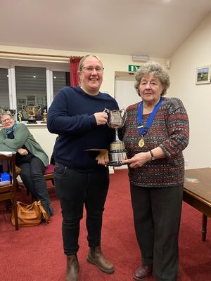 Allscott’s aces – averages winner Casey Starling receives the championship trophy from ladies league president Rose Southgate