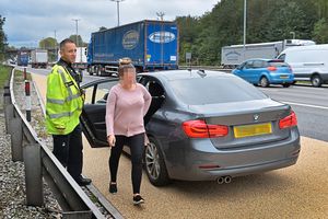 Pulled on to the hard shoulder. This woman ended up with a fine and six points on her licence after being stopped by police.