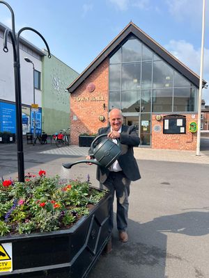 Market Drayton Mayor Tim Manton is urging residents, businesses and schools to take part in the town's bloom competition. 