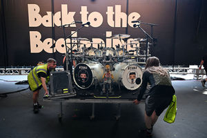 Roadies move euqipment on stage on the eve of British rock band, Black Sabbath's "Back to the Beginning" concert, Ozzy Osbourne's final ever gig as Black Sabbath's frontman at Villa Park in Birmingham, central England on July 4, 2025. Osbourne, who revealed in 2020 that he has Parkinson's disease, will join Tony Iommi, Geezer Butler and Bill Ward for the all-day "Back To The Beginning" show in Birmingham, central England, where the heavy metal giants formed in 1968. (Photo by ANDY BUCHANAN / AFP) (Photo by ANDY BUCHANAN/AFP via Getty Images)          
