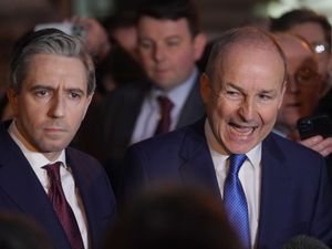 Fine Gael leader Simon Harris and Fianna Fail leader Micheal Martin (PA)