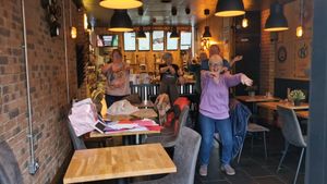 The people inside Artisan Espresso Bar were more than happy to join in