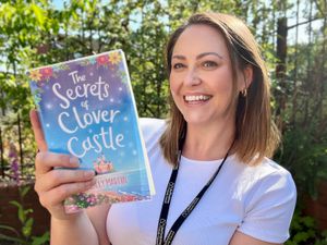 Tara Spandrzyk, a library supervisor in Perton, shows off a copy of The Secrets of Clover Castle, the fifth most favoured book