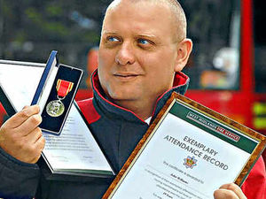Supporting image for story: Tipton fireman gets long service award