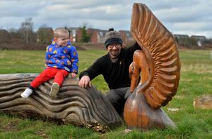 Robot Cossey with Lewis on the Swan bench