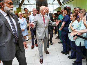 The King is greeted by staff during his visit to officially open the new Midland Metropolitan University Hospital in Birmingham