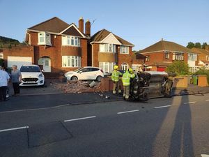 Supporting image for story: Drink-drive arrest after car crashes into wall and rolls over in front of house
