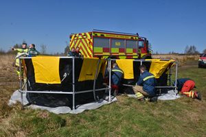 Fire crews had set up a structure to hold water as they dampened down hotspots 