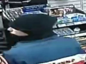 Supporting image for story: CCTV released as masked robbers target two shops in raids