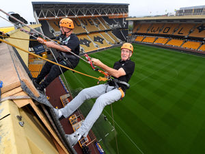 Supporting image for story: Wolves legends and thrill-seekers get a unique view of Molineux in charity abseil off stadium roof