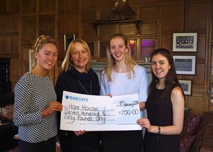 The students and Vanessa with the cheque