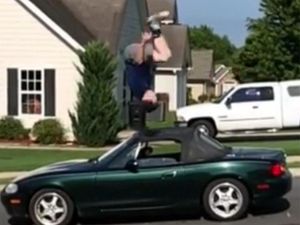 Supporting image for story: Watch: Gravity-defying jumper leaps onto vending machines and over cars