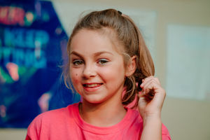 10-year-old Courney before removing her locks for charity