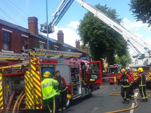 Supporting image for story: Dudley Road closed as 15 firefighters tackle Tipton roof blaze