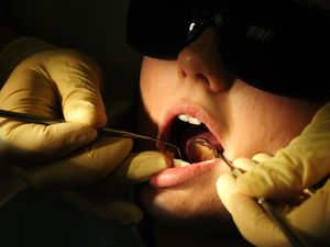 A person receives dental care