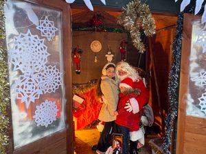 Children visiting Father Christmas in his grotto