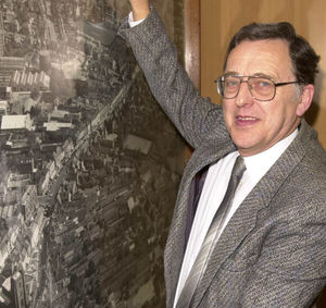 Malcolm with an aerial photograph of Newport