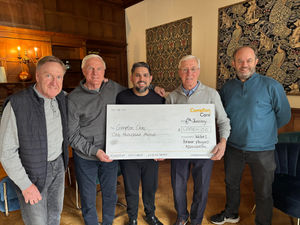 Former Wolves players Steve Daley, Mel Eves and John Richards, and Wolves FPA communications officer Paul Berry present a cheque to Tom Keen from Compton Care.