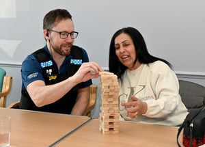PCSO Wayne Jervis and Herjiti Kaur enjoy a game of Jenga