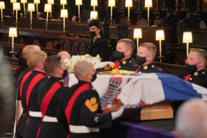 The Duchess of Cambridge watches as the pallbearers carry the coffin inside