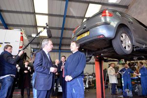 UKIP leader Nigel Farage chats with owner Andrew Yates at Bird and Yates Vehicle Repair Centre, in Brookfield Drive, Cannock