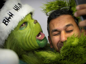 Supporting image for story: The Grinch poses for selfies and frolicks with staff and patients bringing Christmas cheer to Wolverhampton hospital 