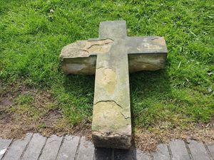 Supporting image for story: Stone cross stolen from graveyard is returned to church by police