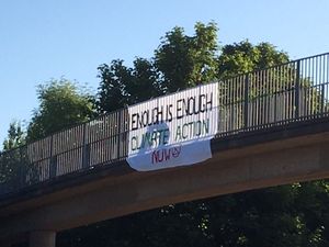 Protesters with bannisters over the M54