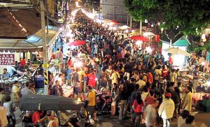 Thousands crowd into the Sunday night market on Rachadamnoen Road in Chiang Mai’s historic city centre