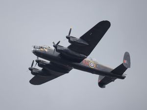 A Lancaster Bomber taking part in the flypast over Buckingham Palace