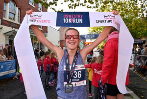 Bethan Jones celebrates being the first woman to cross the finish line in Oswestry