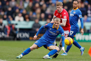 Taylor Perry battles with Wrexham's James McClean (AMA)