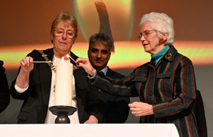 The Mayor of Dudley Sue Greenaway and Eva Clarke light a candle of remembrance