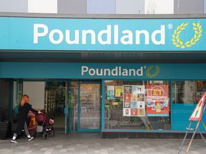 View of a Poundland shop as a customer walks inside