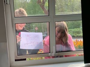 Supporting image for story: Police chief in hospital with coronavirus 'emotional' as family say hello through window
