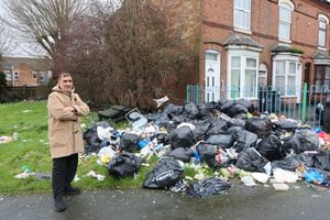 Image shows local resident Sabir Hussain standing next to rubbish at Henry Barber Park in Bordesley Green, Birmingham.