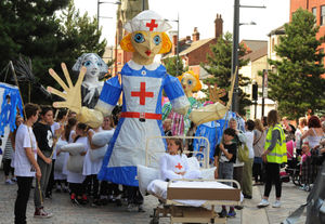 A parade of giant Madeleine Carroll characters, as part of Sandwell Arts Festival, outside Central Sixth, West Bromwich, in 2015.