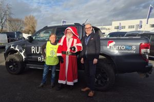Caption for photo 1: Santa with Rotarian David Morris (left) and James Biggs of Furrows.